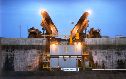 400 ton 797B Caterpillar trucks carry raw ore from the mine to the crusher, 24 hours a day, 365 days a year at Muskeg River mine.