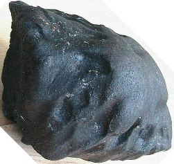 Figure 2. A recovered fusion crust coated and oriented mass of Villalbeto de la Peña Spain.